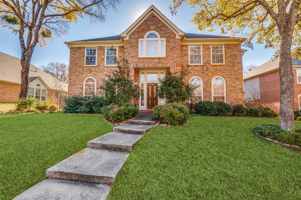 view of front of property with a front lawn