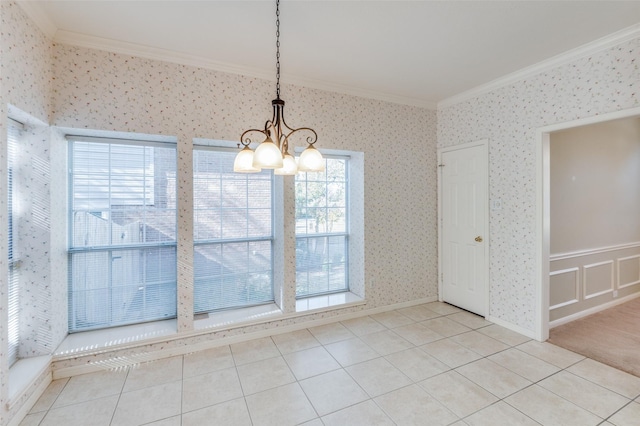 unfurnished dining area featuring crown molding, an inviting chandelier, and light tile patterned floors