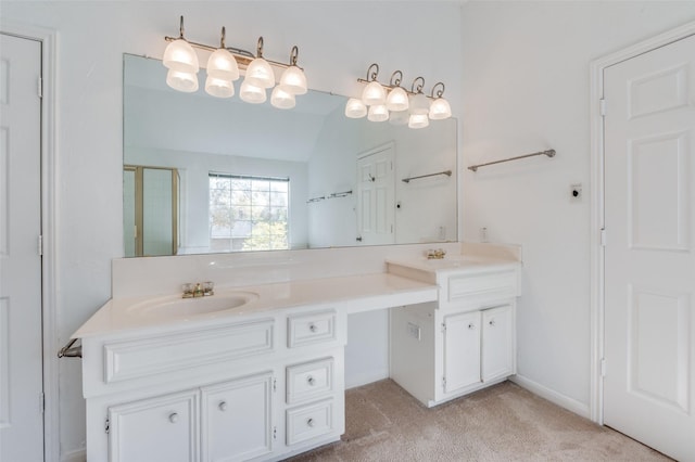 bathroom with vanity, an enclosed shower, and vaulted ceiling