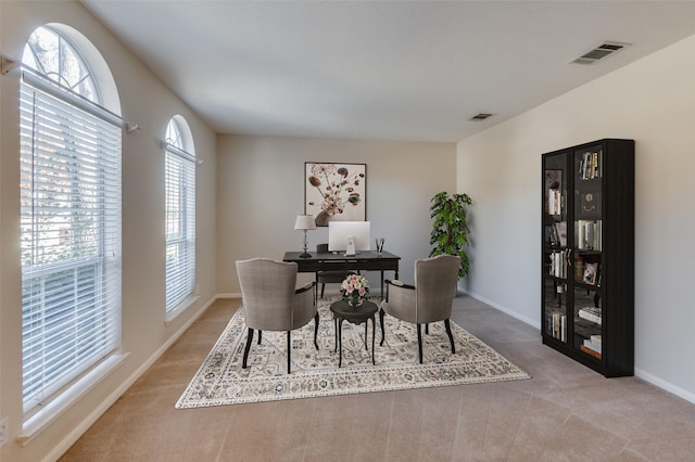 dining area with light carpet