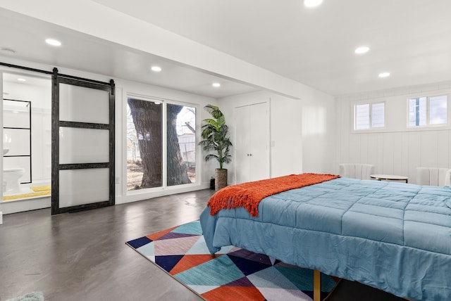 bedroom with a barn door