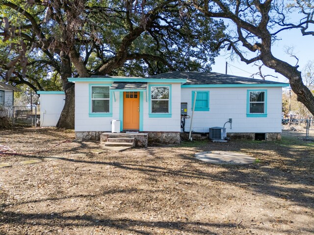 ranch-style house featuring cooling unit