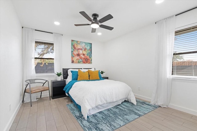 bedroom featuring ceiling fan and light hardwood / wood-style floors