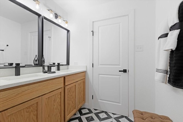 bathroom with tile patterned floors and vanity