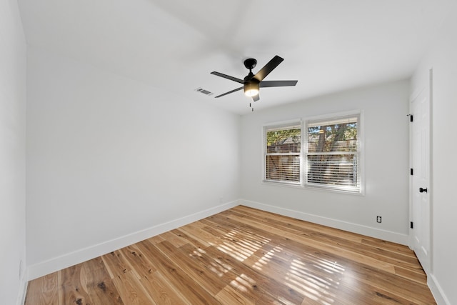 spare room featuring hardwood / wood-style flooring and ceiling fan