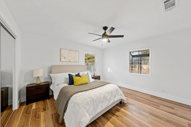 bedroom with ceiling fan and light hardwood / wood-style floors