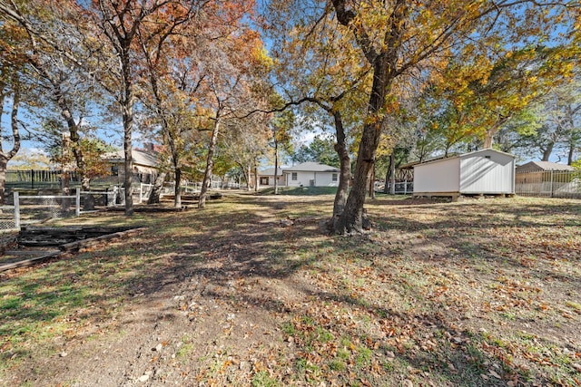 view of yard with a storage shed