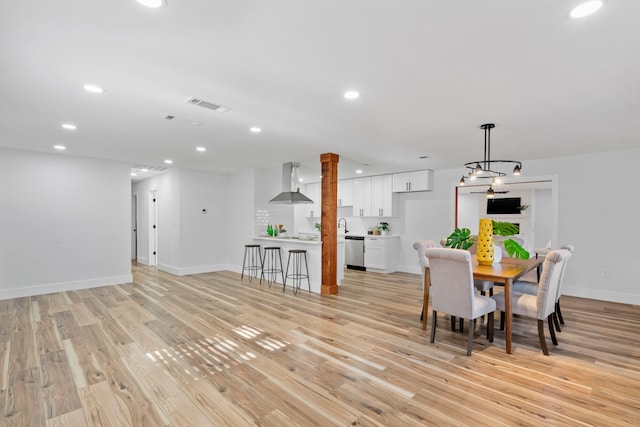 unfurnished dining area with light hardwood / wood-style floors and sink