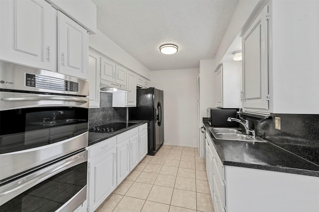 kitchen with white cabinets, a textured ceiling, sink, and black appliances