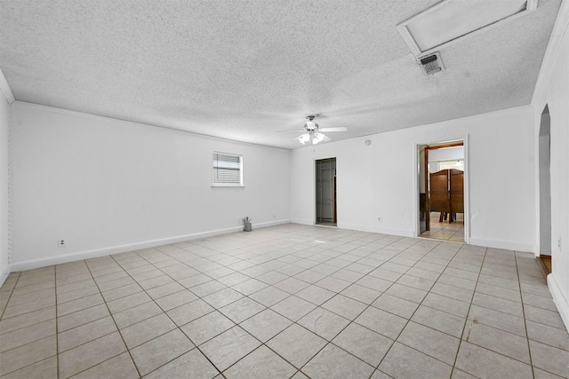 tiled spare room with ceiling fan