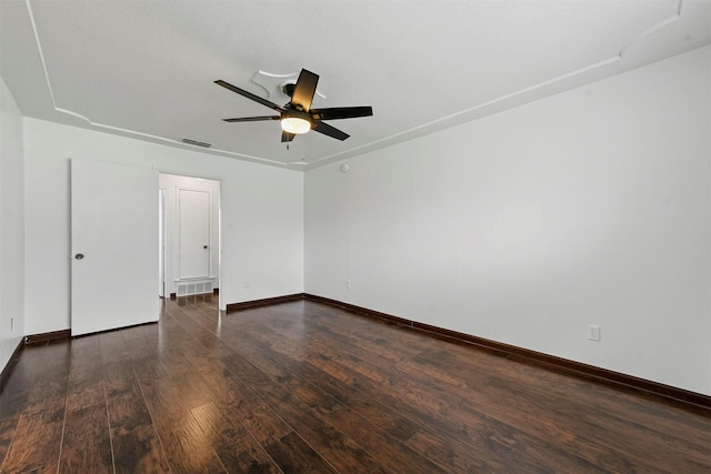 unfurnished room featuring dark hardwood / wood-style floors and ceiling fan