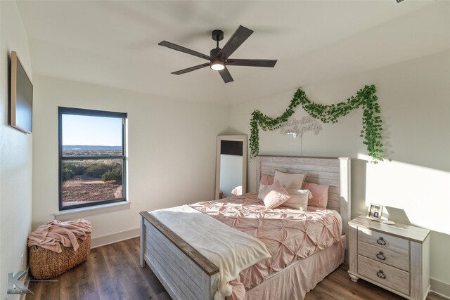 bedroom featuring ceiling fan and dark wood-type flooring