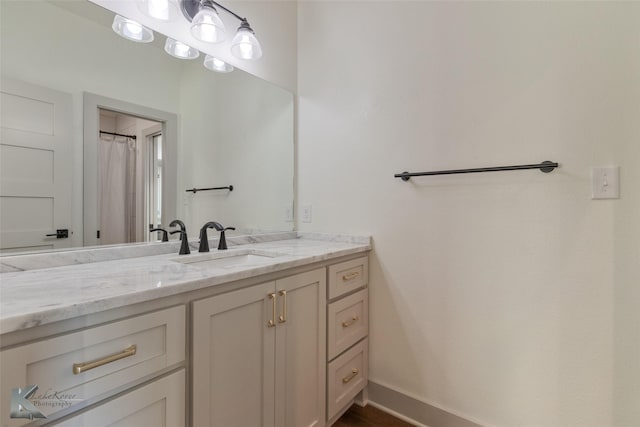 bathroom with vanity and walk in shower