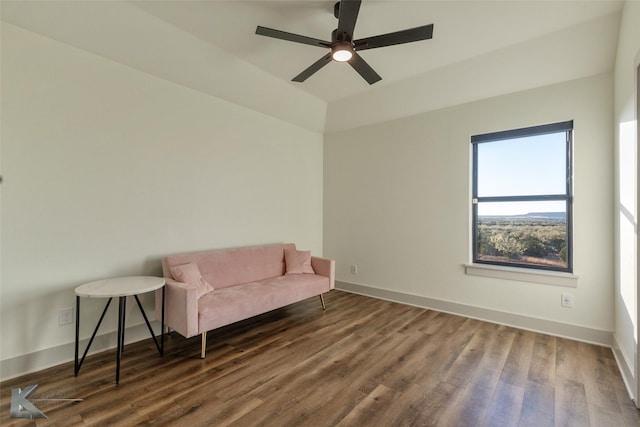 sitting room featuring ceiling fan and dark wood-type flooring