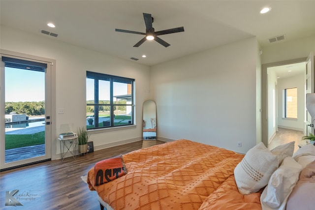 bedroom featuring access to outside, ceiling fan, and dark hardwood / wood-style flooring