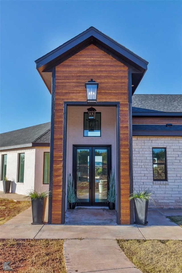 property entrance featuring french doors