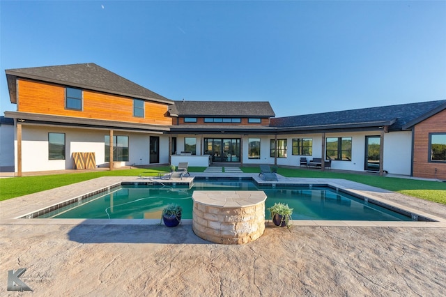 view of pool featuring a yard and a patio area