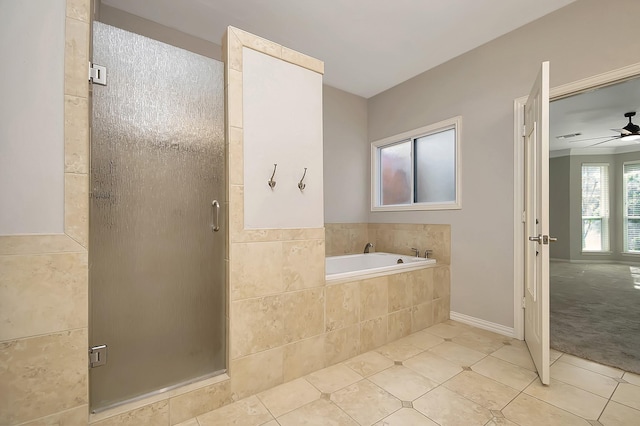 full bath featuring a stall shower, tile patterned floors, a bath, and a ceiling fan