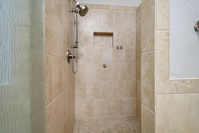 bathroom featuring tiled shower