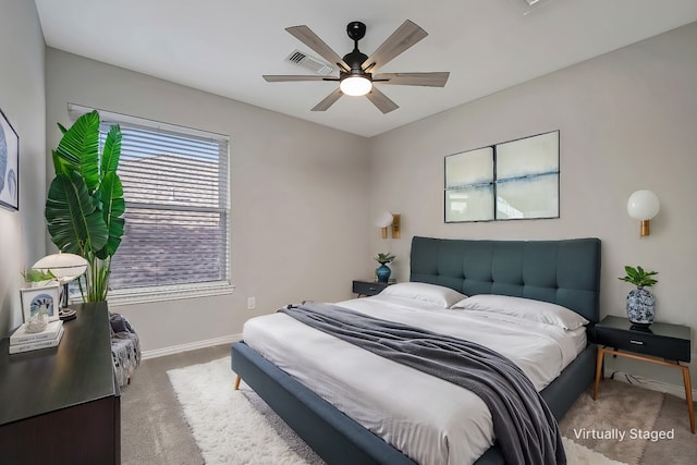 bedroom with ceiling fan, visible vents, baseboards, and carpet flooring