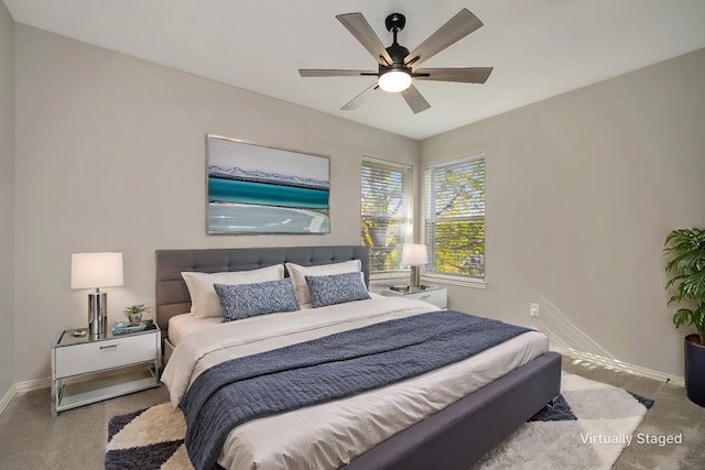 bedroom featuring ceiling fan and baseboards