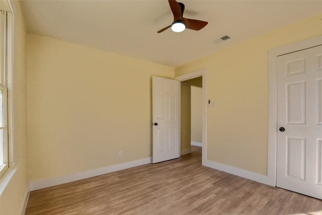 unfurnished bedroom with hardwood / wood-style flooring and ceiling fan