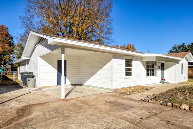 view of front of property with a carport