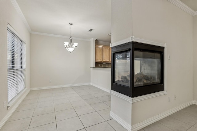 interior space featuring light tile patterned floors, pendant lighting, and crown molding