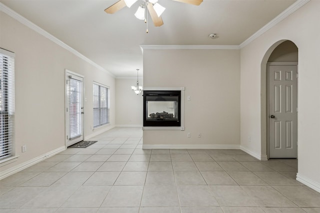 unfurnished living room featuring a multi sided fireplace, ceiling fan, light tile patterned flooring, and ornamental molding