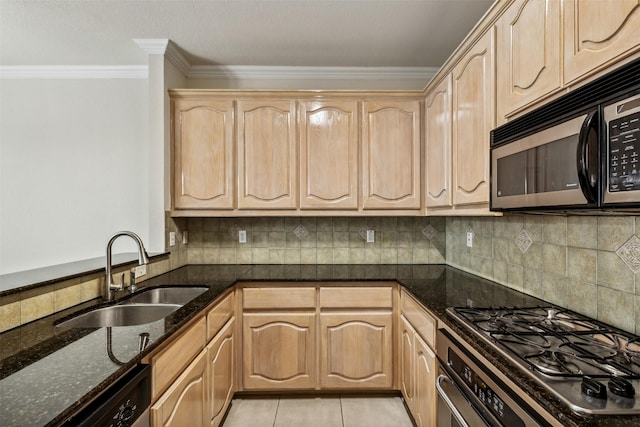 kitchen featuring light brown cabinets, dark stone counters, sink, light tile patterned floors, and stainless steel appliances