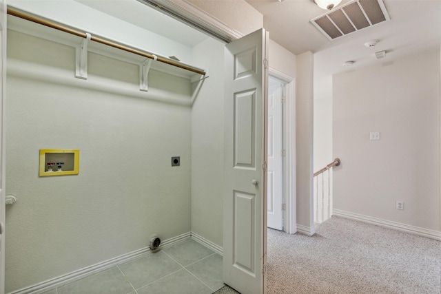 laundry room featuring hookup for a washing machine, light tile patterned flooring, and hookup for an electric dryer