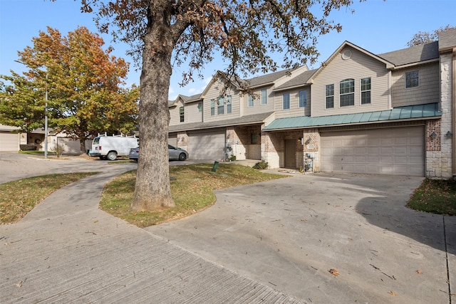 townhome / multi-family property featuring a garage