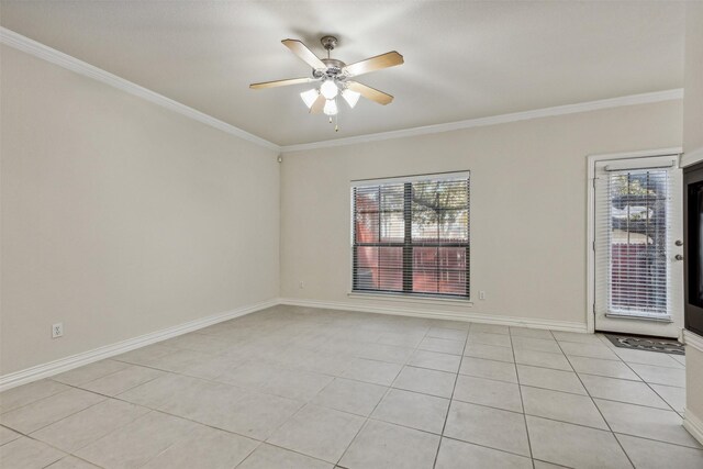 unfurnished room featuring light tile patterned floors and ornamental molding