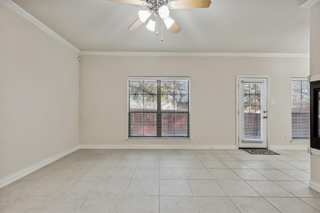 empty room featuring ceiling fan, ornamental molding, and light tile patterned floors