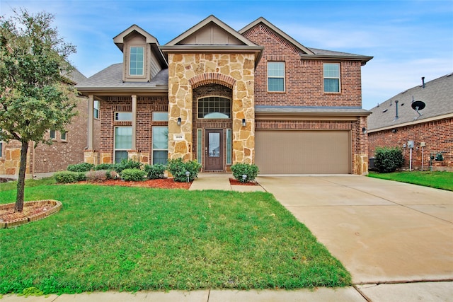 view of front of property featuring a front yard and a garage