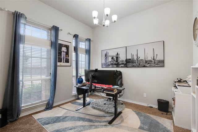 office featuring carpet floors and a notable chandelier