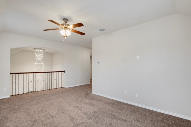 carpeted spare room with ceiling fan and lofted ceiling