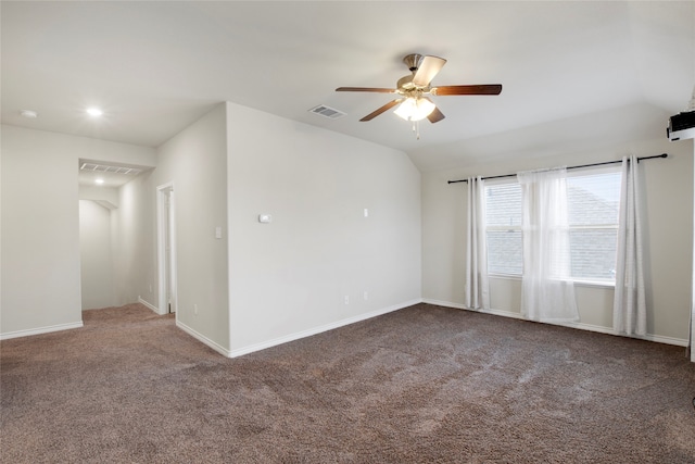 unfurnished room with ceiling fan, carpet floors, and vaulted ceiling