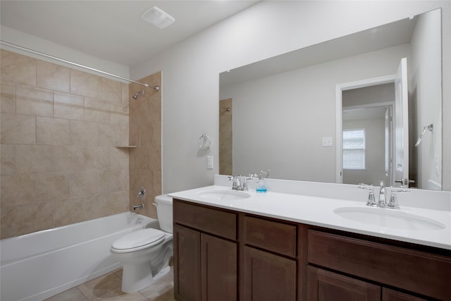 full bathroom with tile patterned floors, vanity, toilet, and tiled shower / bath