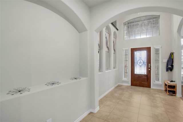 foyer entrance with light tile patterned floors