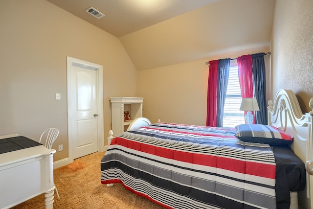 bedroom featuring lofted ceiling and carpet floors