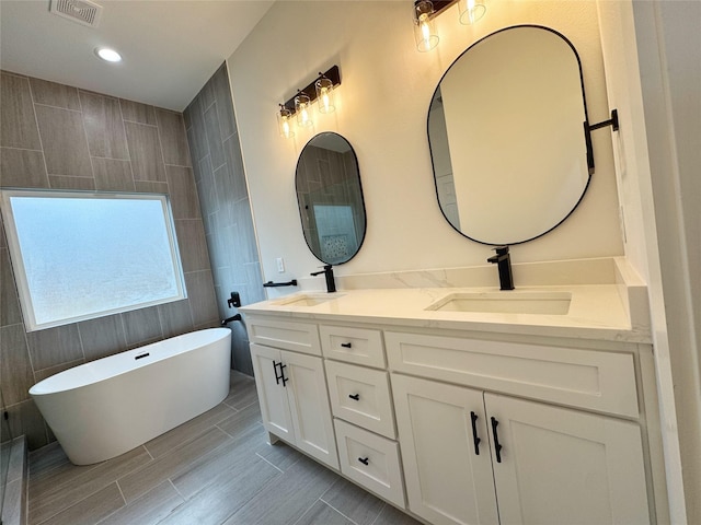 washroom with cabinets, hookup for a washing machine, electric dryer hookup, and dark wood-type flooring