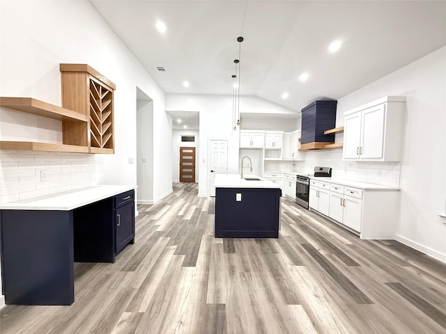 kitchen with pendant lighting, dishwasher, sink, ceiling fan, and an island with sink