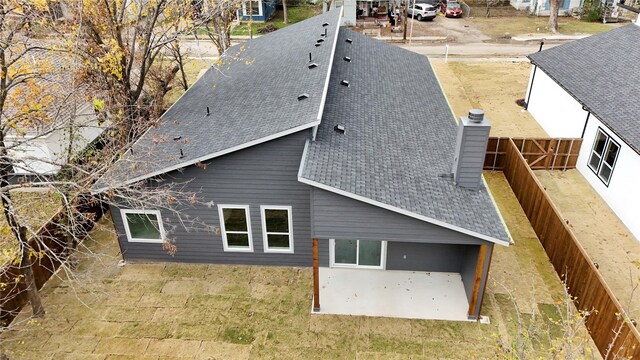 view of side of property with a patio area