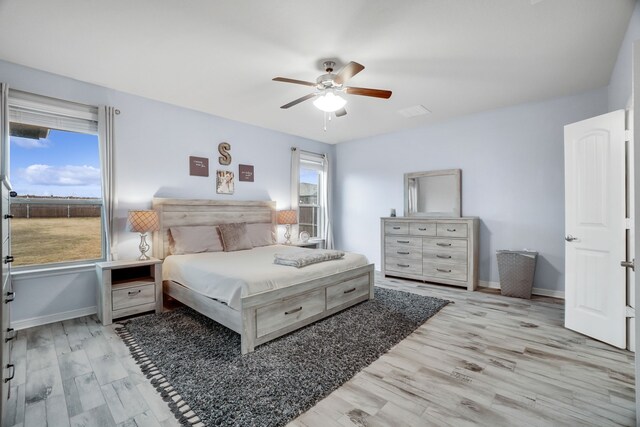 empty room featuring ceiling fan and light carpet