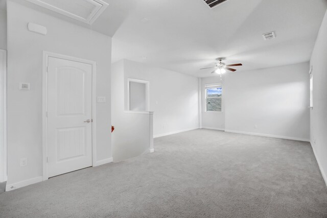 carpeted empty room featuring ceiling fan