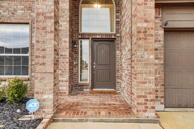 view of front of house featuring a garage and a front yard