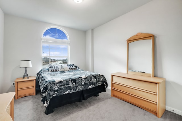 bedroom featuring light colored carpet