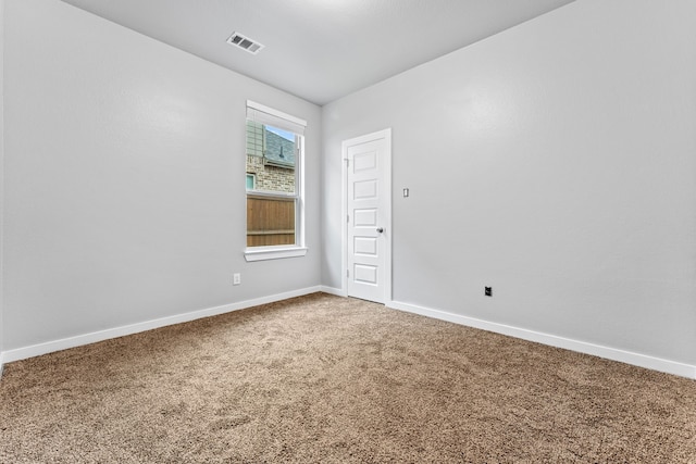 unfurnished room featuring carpet floors