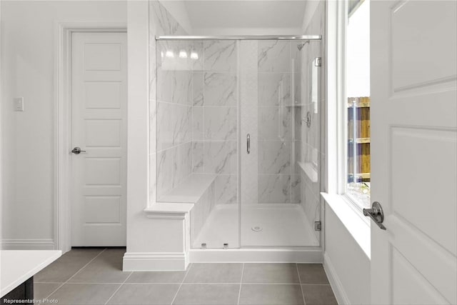 bathroom featuring tile patterned floors and an enclosed shower